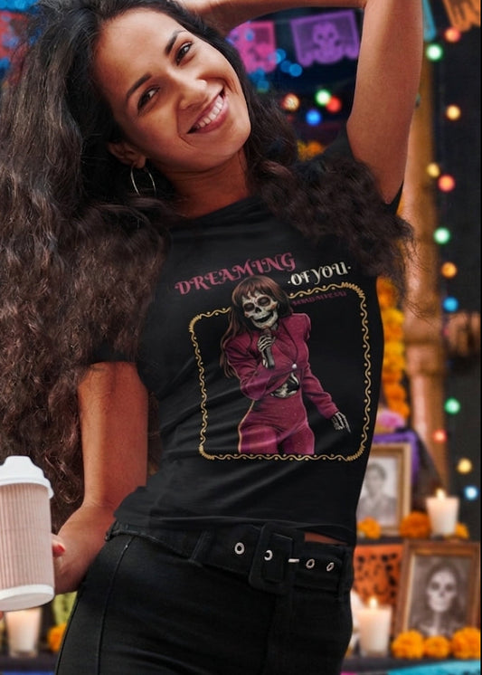 Black fitted women's t-shirt with a vintage graphic of a skeleton singer in a purple jumpsuit with the text "DREAMING OF YOU".