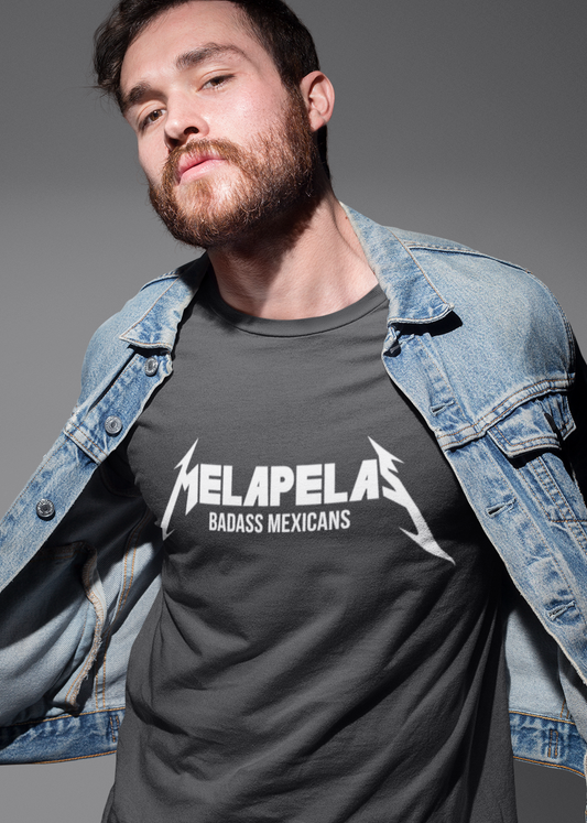 Black crew-neck t-shirt with "MELAPELAS" printed across the chest in a sharp white heavy-metal lightning font, with "BADASS MEXICANS" in small white text below.
