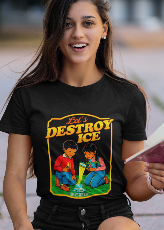 A woman wearing a black t-shirt with a vintage-style illustration of a boy and a girl melting an ice cube and the phrase “Let’s Destroy ICE” in bold retro typography.
