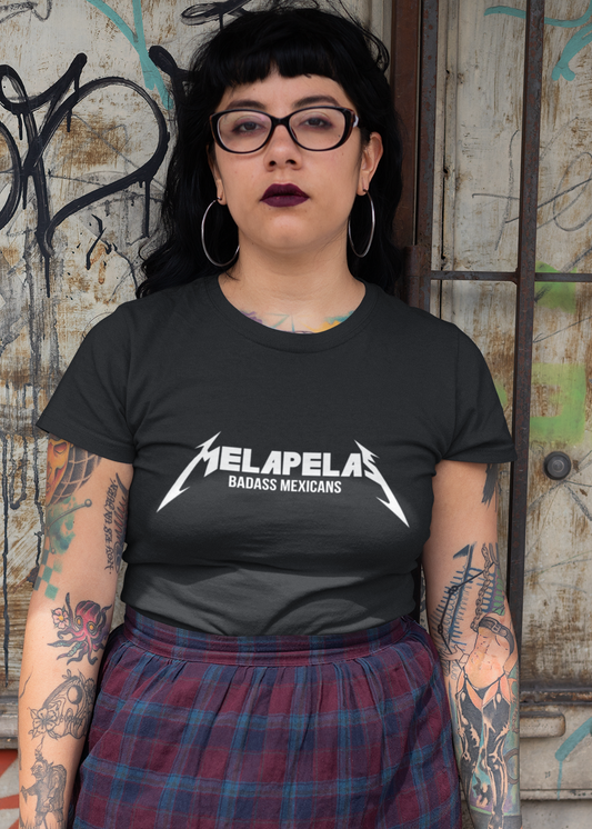 Black fitted women's crew-neck t-shirt with "MELAPELAS" printed in a sharp white heavy-metal lightning font and small white text underneath.