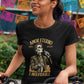 Black t-shirt featuring a detailed Catrín graphic of Juan Gabriel holding a microphone surrounded by golden text reading "AMOR ETERNO E INOLVIDABLE".