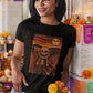 Black t-shirt with an artistic painting parodying Munch's The Scream featuring a sugar skull skeleton figure and moon.