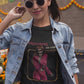 Black fitted women's t-shirt with a vintage graphic of a skeleton singer in a purple jumpsuit with the text "DREAMING OF YOU".