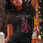 Black fitted women's t-shirt with a vintage graphic of a skeleton singer in a purple jumpsuit with the text "DREAMING OF YOU".