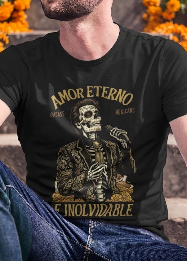 Black t-shirt featuring a detailed Catrín graphic of Juan Gabriel holding a microphone surrounded by golden text reading "AMOR ETERNO E INOLVIDABLE".