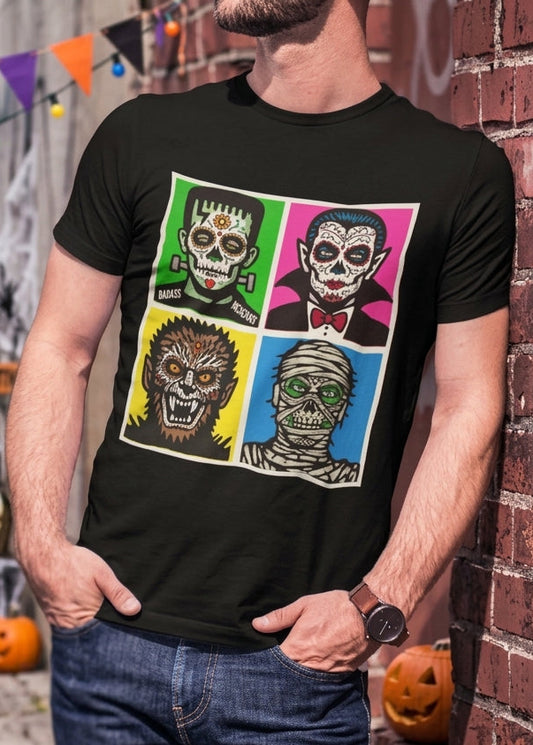 Black t-shirt featuring a 4-panel colorful pop art graphic of classic horror monsters styled as Mexican sugar skulls.