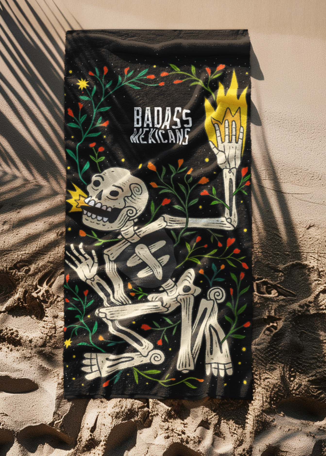 beach-towel-flat-laid-on-the-beach showing a mexican skeleton 