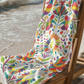 tenango inspired beach towel with colorful birds flowers and mexican folk art style design in pink yellow orange and green