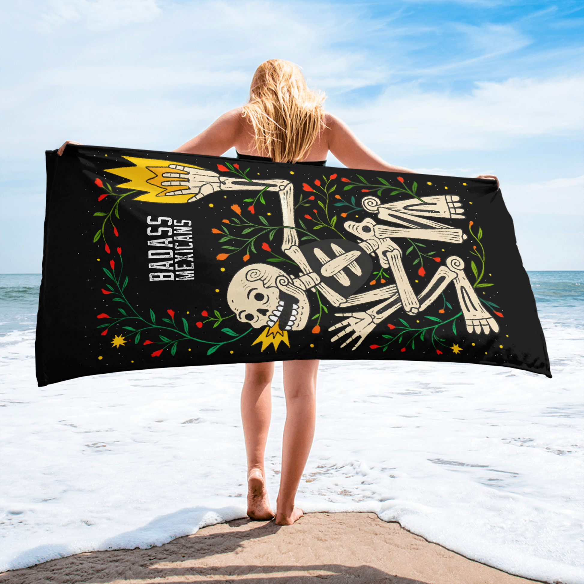 beach-towel-flat-laid-on-the-beach showing a mexican skeleton 