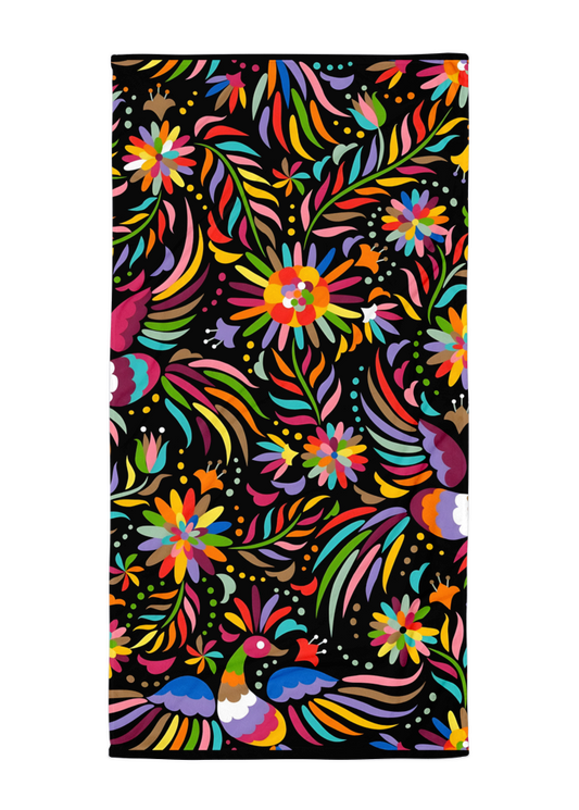 otomi inspired black beach towel with colorful birds flowers and mexican folk art style design on dark background