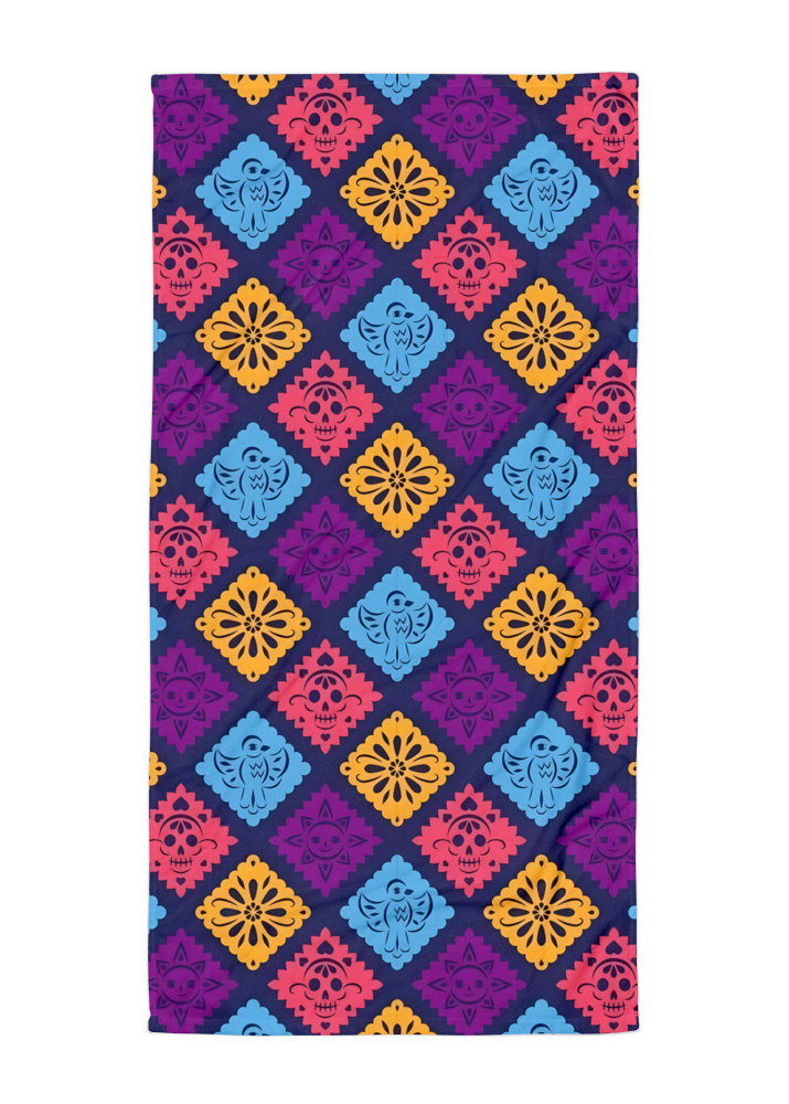 purple papel picado inspired beach towel with colorful skulls suns birds and floral shapes in mexican folk art style