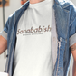 White crew-neck t-shirt with "Sanababish" printed across the chest in a stylized font with a bricks textured pattern, and "BADASS MEXICANS" in small black text below.