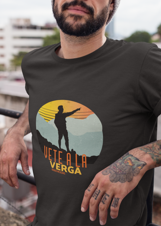 Black crew-neck t-shirt with a colorful retro circular sunset graphic showing a mountain hiker silhouette pointing forward above orange and yellow text "Vete a la verga".