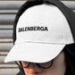 White dad hat style cap, embroidered with the legend BALENBERGA