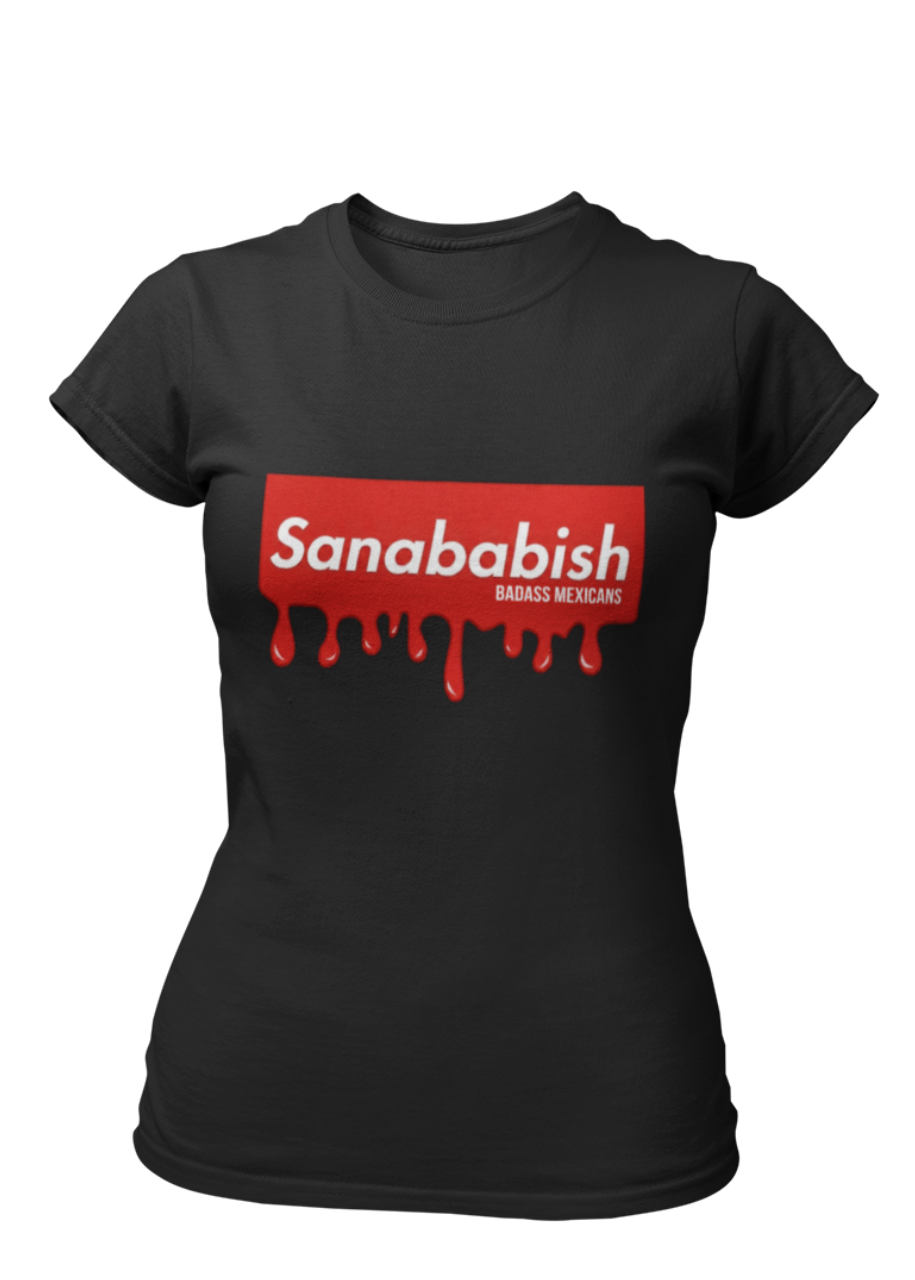 A black crew-neck t-shirt featuring a solid red rectangular box graphic on the chest. Inside the box, the word "Sanababish" is printed in a bold white, slanted font, with the words "BADASS MEXICANS" in smaller white letters beneath it. The bottom edge of the red box is styled to look like wet paint, with thick red droplets dripping down onto the fabric.