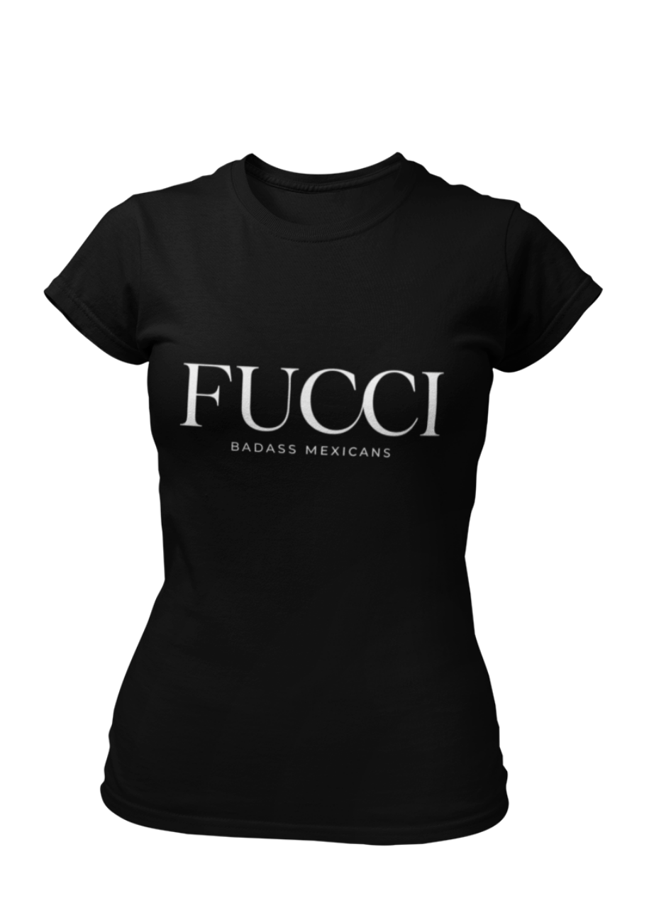 A Black lifestyle t-shirt featuring the word "FUCCI" printed in a large, elegant White serif font across the chest. Below it, the brand name "BADASS MEXICANS" is printed in a smaller, clean sans-serif font.