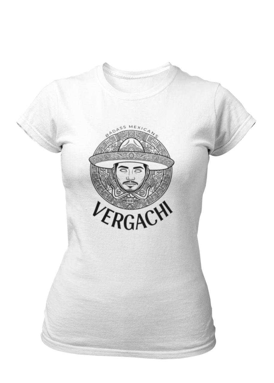 A white t-shirt featuring a large black graphic. The design includes a circular Aztec calendar-style background with a stylized man wearing a traditional Mexican charro hat in the center. The word "VERGACHI" is printed in a bold, arched serif font underneath the graphic, with "BADASS MEXICANS" in a small arch above it.