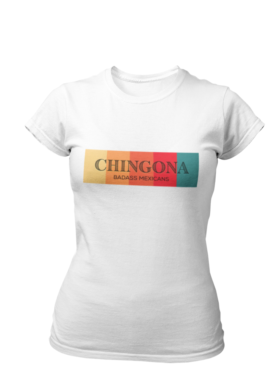 A white fitted women's crew-neck t-shirt featuring a horizontal graphic design across the chest. The design features five vertical, vintage-toned color blocks lined up side-by-side in pastel yellow, soft orange, terracota red, deep pink, and muted teal. Overlaid across these colorful blocks, the word "CHINGONA" is printed in a large, elegant dark gray serif font, with the words "BADASS MEXICANS" written directly underneath in a smaller, clean sans-serif typeface.