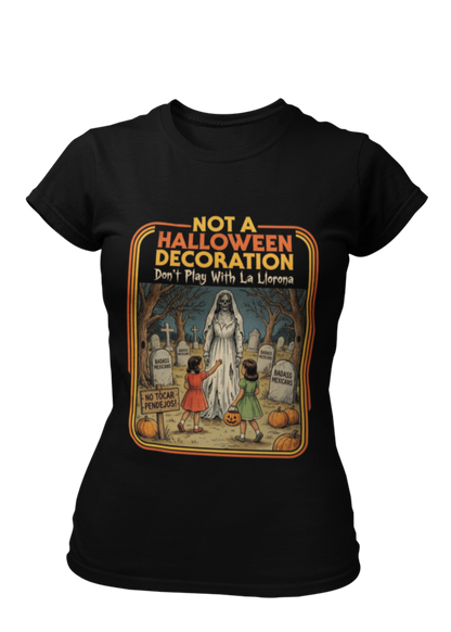 Black t-shirt featuring a retro horror poster illustration of La Llorona in a graveyard above the text "NOT A HALLOWEEN DECORATION Don't Play With La Llorona".