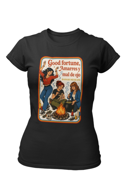 Black fitted t-shirt featuring a retro 70s illustration of three witches around a campfire with the text "Good fortune, Amarres y mal de ojo".