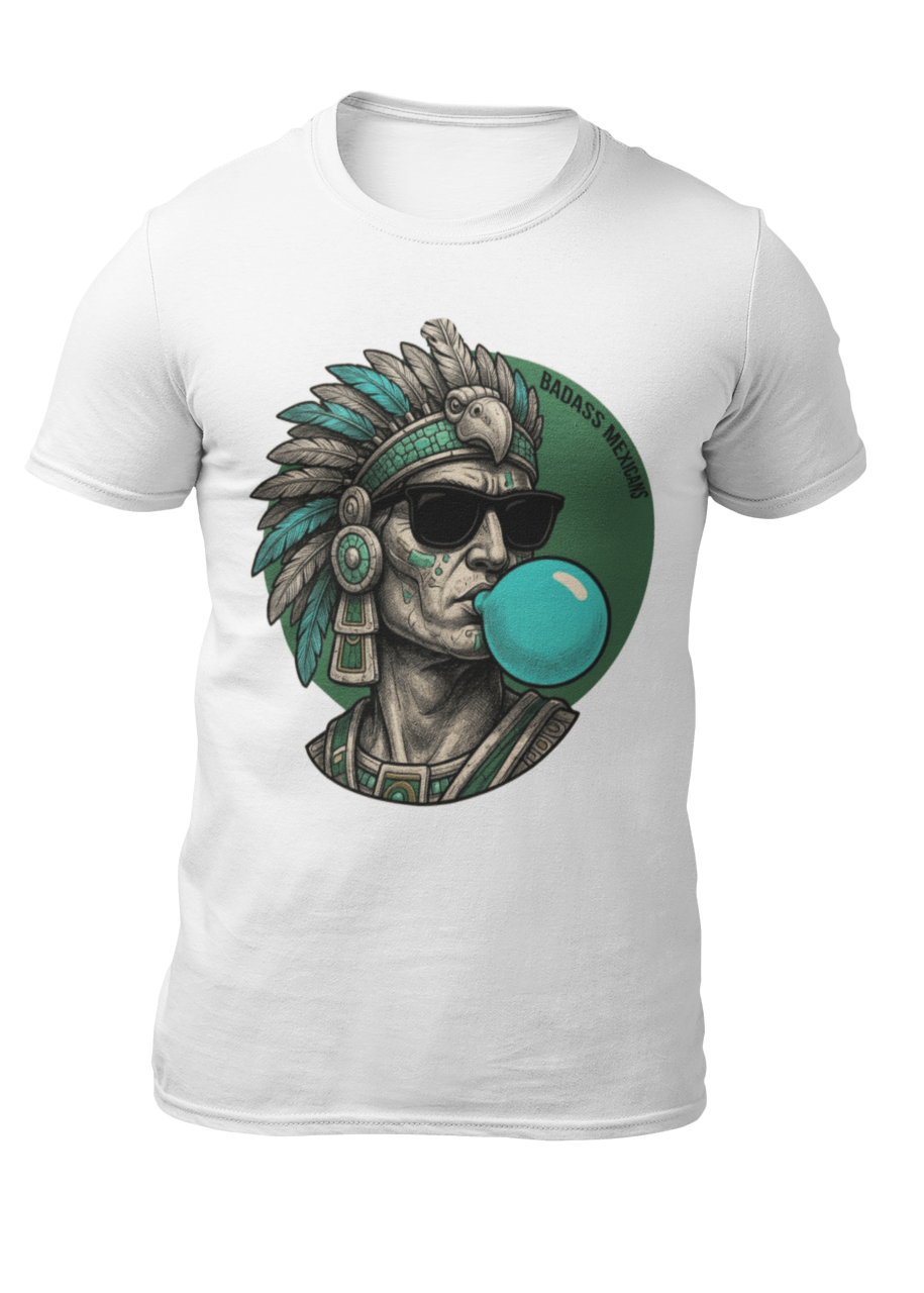 A white crew-neck t-shirt featuring a circular graphic illustration on the chest. The design depicts an Aztec ruler or warrior chief in profile, wearing a highly detailed traditional feathered headdress and ear spools in shades of turquoise, green, and gray. The character is styled with a modern twist, wearing black sunglasses and blowing a large, bright light-blue bubblegum bubble. The entire illustration is set against a dark green solid circular background with the words "BADASS MEXICANS" written