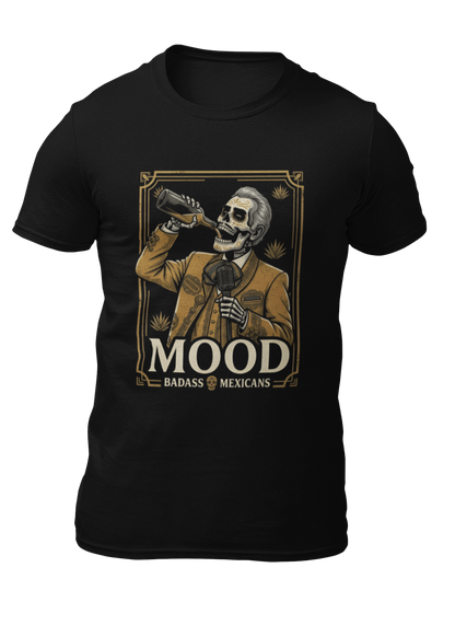 A high-quality graphic on a black t-shirt featuring a skeleton dressed in a traditional gold and brown Mariachi suit. The skeleton is holding a vintage microphone and drinking from a bottle. The design is framed in an elegant vintage border with the word "MOOD" in large serif letters and "BADASS MEXICANS" underneath.