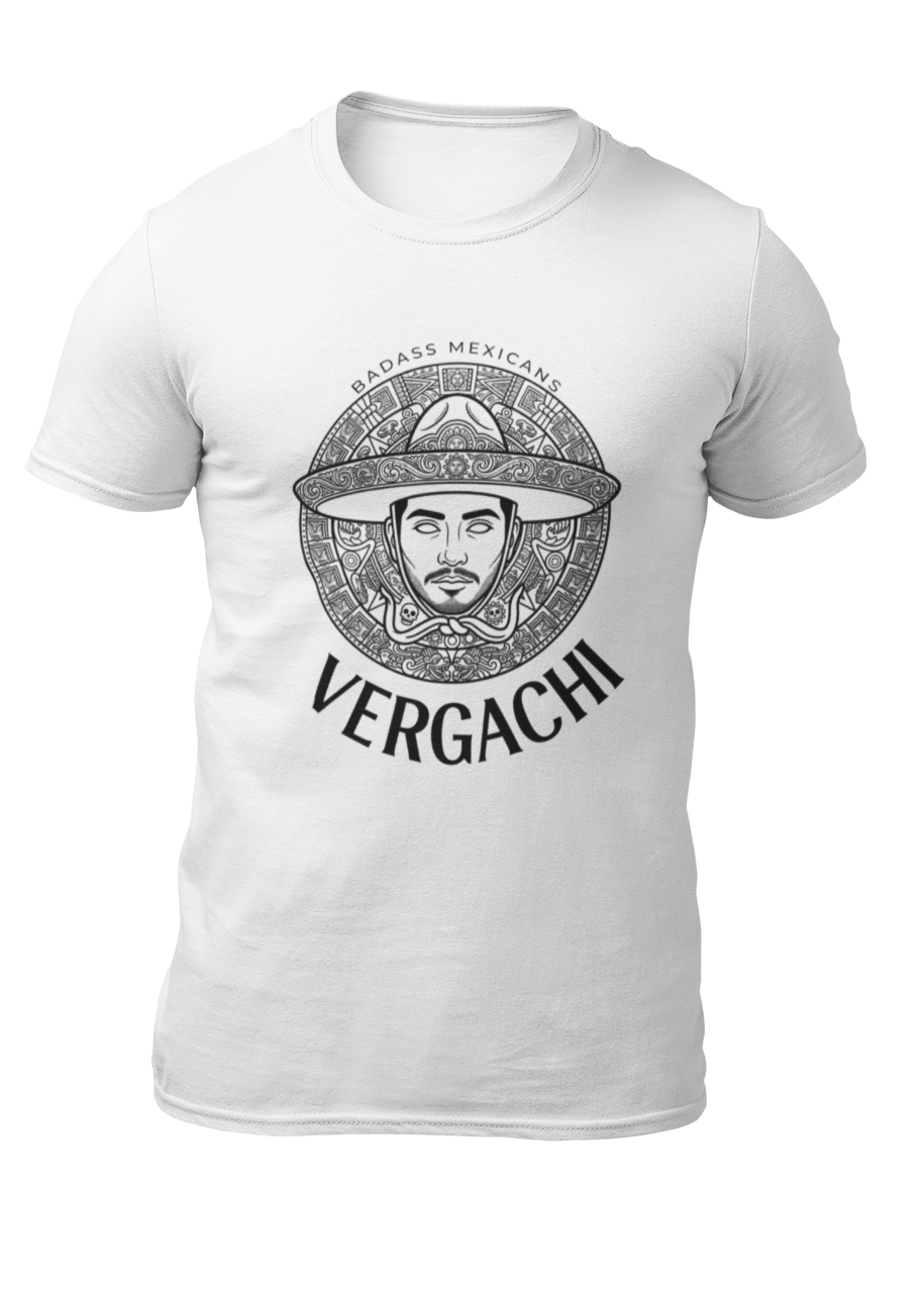 A white t-shirt featuring a large black graphic. The design includes a circular Aztec calendar-style background with a stylized man wearing a traditional Mexican charro hat in the center. The word "VERGACHI" is printed in a bold, arched serif font underneath the graphic, with "BADASS MEXICANS" in a small arch above it.