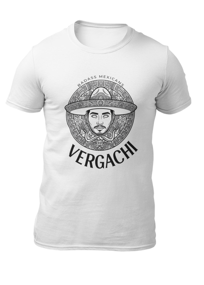 A white t-shirt featuring a large black graphic. The design includes a circular Aztec calendar-style background with a stylized man wearing a traditional Mexican charro hat in the center. The word "VERGACHI" is printed in a bold, arched serif font underneath the graphic, with "BADASS MEXICANS" in a small arch above it.