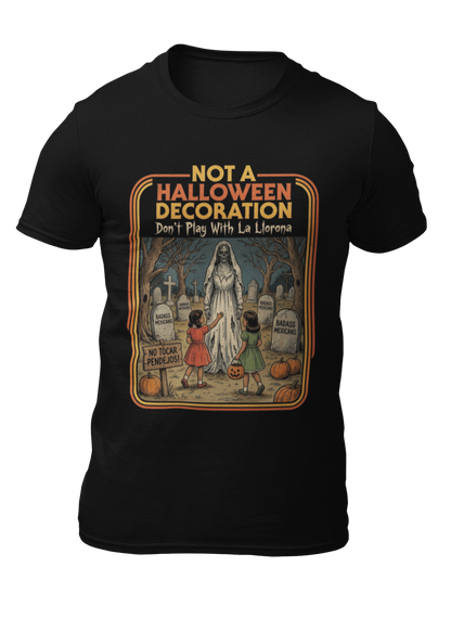 Black t-shirt featuring a retro horror poster illustration of La Llorona in a graveyard above the text "NOT A HALLOWEEN DECORATION Don't Play With La Llorona".