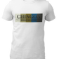 An white crew-neck t-shirt featuring a graphic design printed across the chest. The design consists of five vertical color blocks lined up side-by-side in white, beige, gold, blue, and dark gray. Overlaid on these blocks, the word "CHINGON" is printed in a large, elegant dark gray serif font, with the words "BADASS MEXICANS" written directly underneath in a smaller, clean sans-serif typeface.