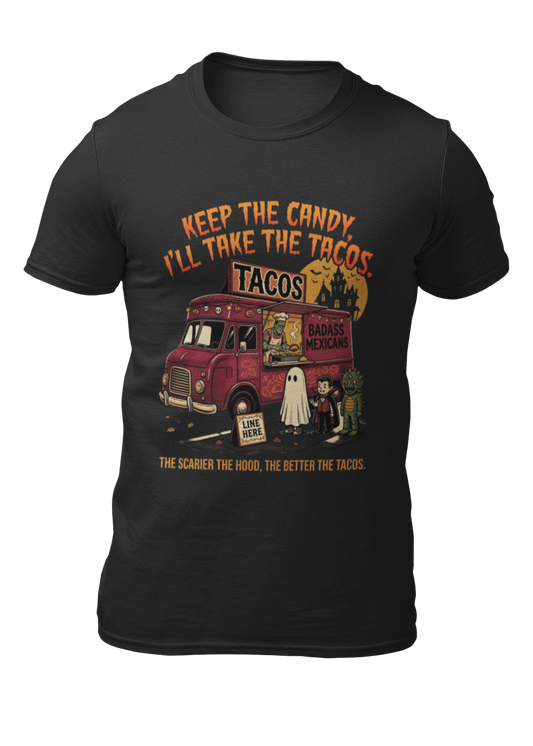 Black t-shirt featuring a spooky taco truck graphic with monsters in line under the text "Keep the candy I'll take the tacos".