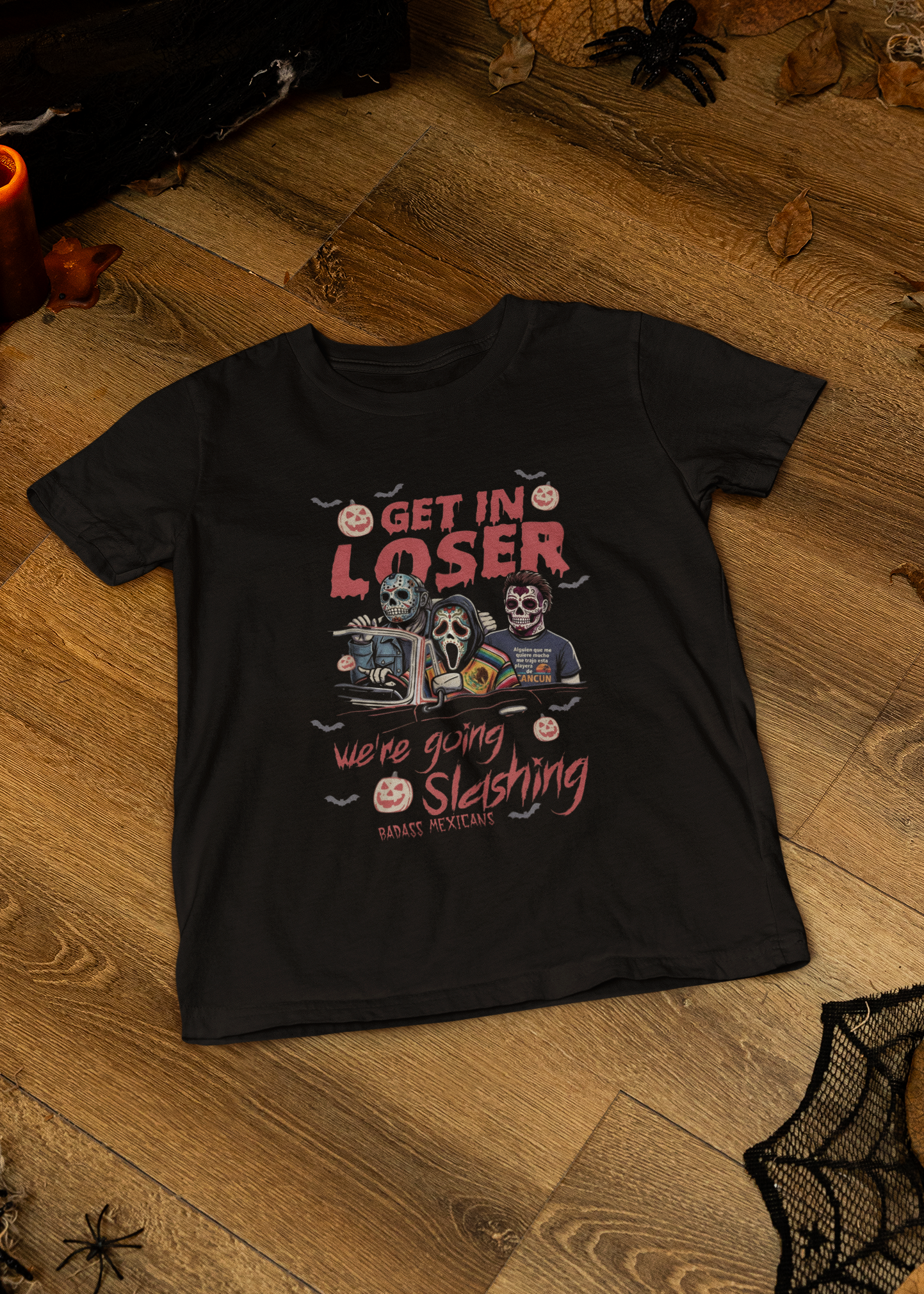 Black t-shirt with "GET IN LOSER WE'RE GOING SLASHING" graphic featuring classic horror villains in a convertible car.