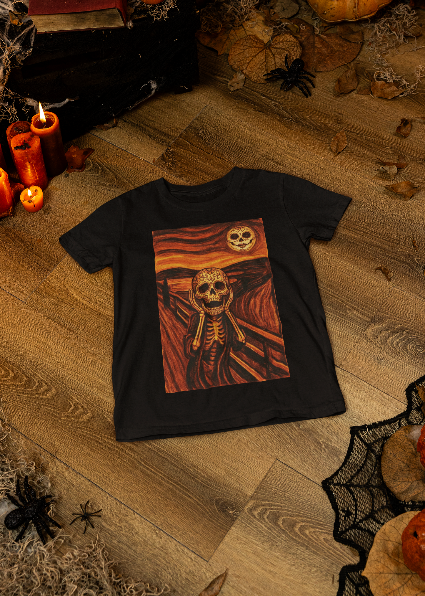 Black t-shirt with an artistic painting parodying Munch's The Scream featuring a sugar skull skeleton figure and moon.