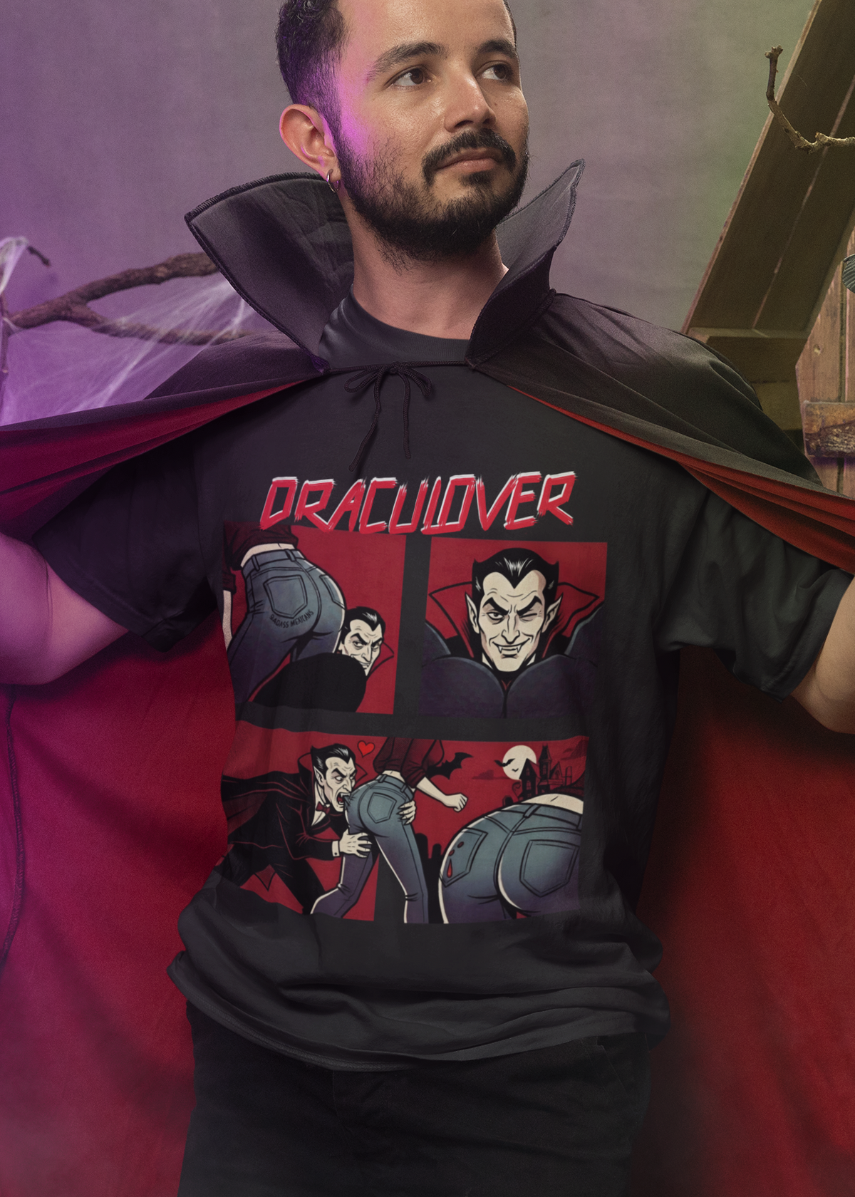 Black t-shirt featuring a red "DRACULOVER" title above a 4-panel comic graphic of a vampire biting a woman wearing blue jeans.