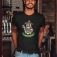 Black t-shirt featuring an illustration of a mustache ghost wearing a Mexican sombrero and sarape holding bottles above text reading "EL BOO-RRACHO".