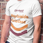 A man wearing a White t-shirt featuring the phrase “Hay Comida En La Casa” in a retro instant noodle-inspired design with orange and brown accents.