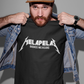 Black crew-neck t-shirt with "MELAPELAS" printed across the chest in a sharp white heavy-metal lightning font, with "BADASS MEXICANS" in small white text below.