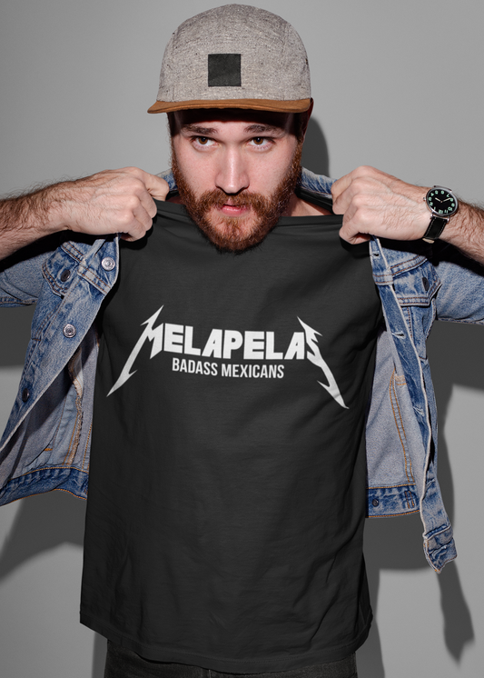 Black crew-neck t-shirt with "MELAPELAS" printed across the chest in a sharp white heavy-metal lightning font, with "BADASS MEXICANS" in small white text below.