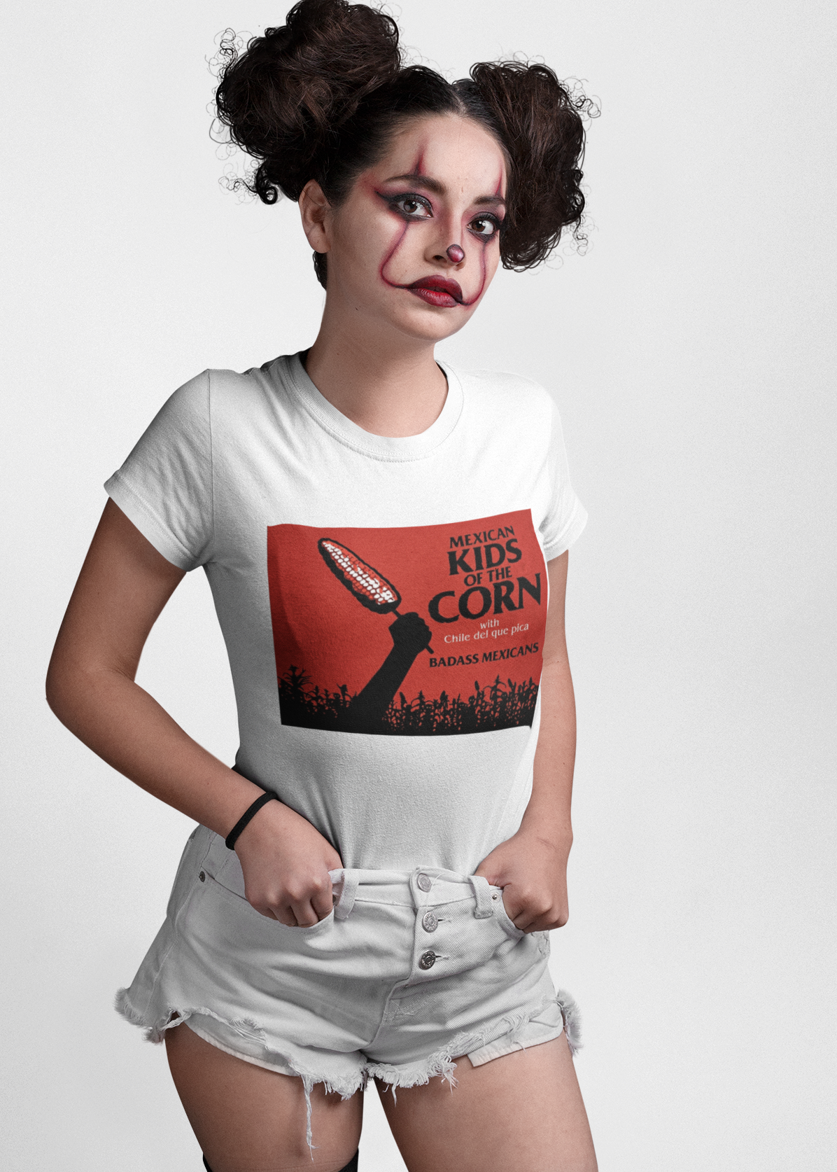 white crew-neck t-shirt featuring a red retro movie poster graphic with a hand holding a spiced corn on a stick above a cornfield silhouette.