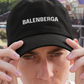 Black dad hat style cap, embroidered with the legend BALENBERGA