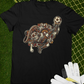 black front and back graphic t-shirt with small badass mexicans logo on front and detailed mexican calavera kicking a futbol ball on the back