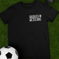 black front and back graphic t-shirt with small badass mexicans logo on front and detailed mexican calavera kicking a futbol ball on the back