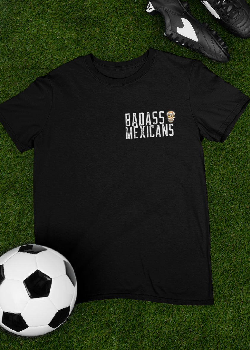 black front and back graphic t-shirt with small badass mexicans logo on front and detailed mexican calavera kicking a futbol ball on the back