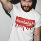 A white crew-neck t-shirt featuring a solid red rectangular box graphic on the chest. Inside the box, the word "Sanababish" is printed in a bold white, slanted font, with the words "BADASS MEXICANS" in smaller white letters beneath it. The bottom edge of the red box is styled to look like wet paint, with thick red droplets dripping down onto the fabric.