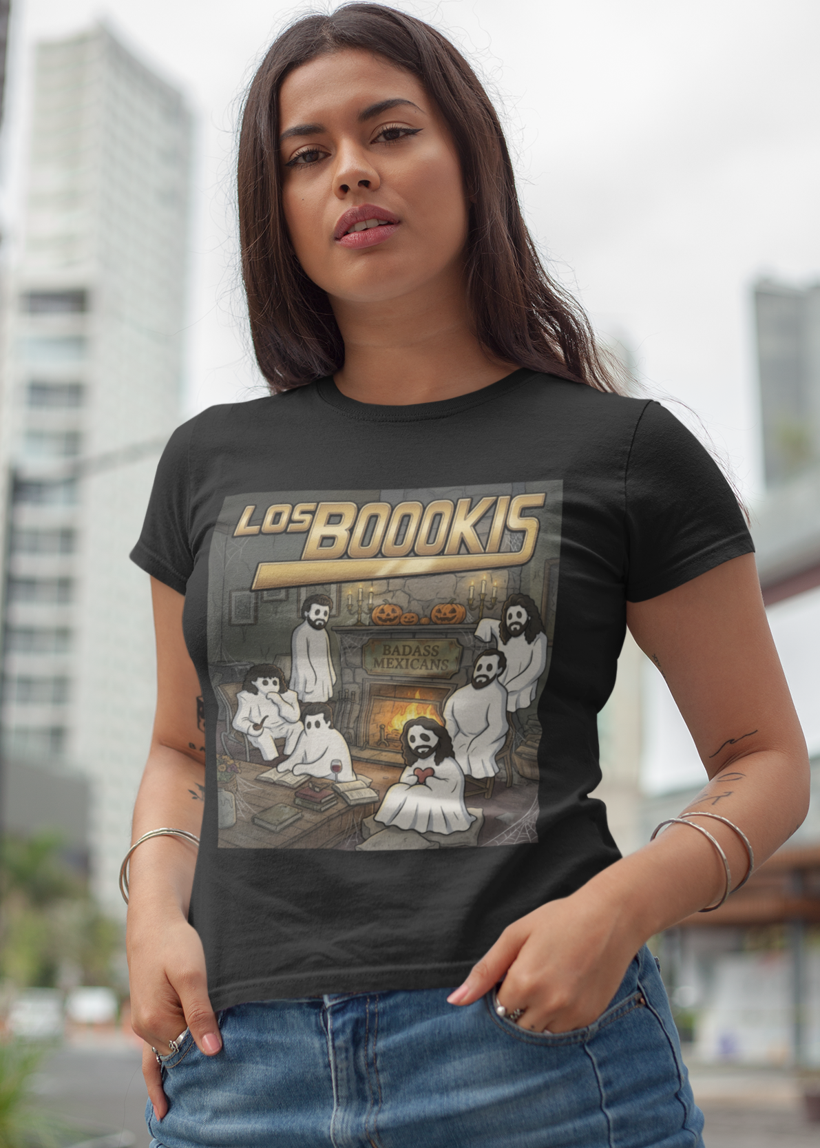 Black t-shirt featuring a spooky band parody with ghosts around a fireplace with text reading "LOS BOOOKIS".