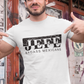 A white crew-neck t-shirt showcasing a bold black graphic design centered on the chest. The design features the word "JEFE" printed in a large, heavy serif font, split horizontally across the middle. The upper half of the letters is set inside a solid black rectangular box that features a white distressed, cracked stone or marble texture. The lower half of the letters extends below the box onto the clean white fabric. Directly underneath the word, "BADASS MEXICANS" is printed in a clean, smaller sans-serif.