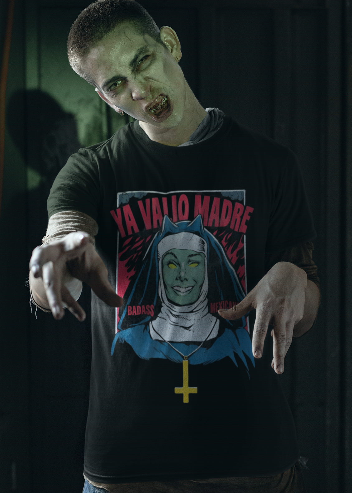 Black t-shirt with a retro comic graphic of a possessed nun and red text reading "YA VALIÓ MADRE".