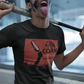 Black crew-neck t-shirt featuring a red retro movie poster graphic with a hand holding a spiced corn on a stick above a cornfield silhouette.
