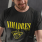 Black crew-neck t-shirt with "NI MADRES" printed in a yellow grunge font above a yellow line-art icon of a smiling man wearing a traditional sombrero.