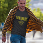 Black crew-neck t-shirt with "NI MADRES" printed in a yellow grunge font above a yellow line-art icon of a smiling man wearing a traditional sombrero.